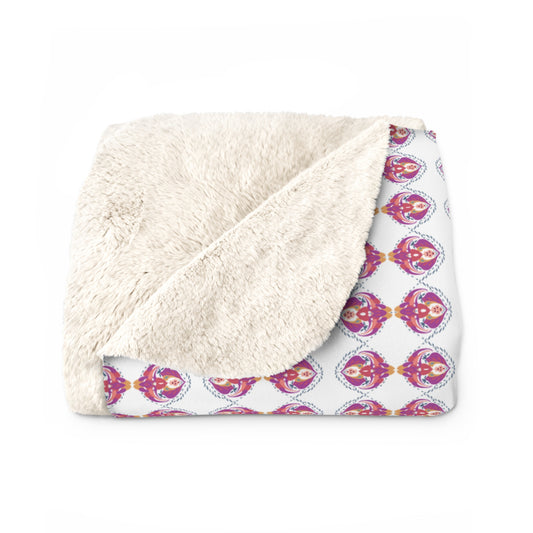 A cozy and luxurious pink and purple motif Sherpa Blanket