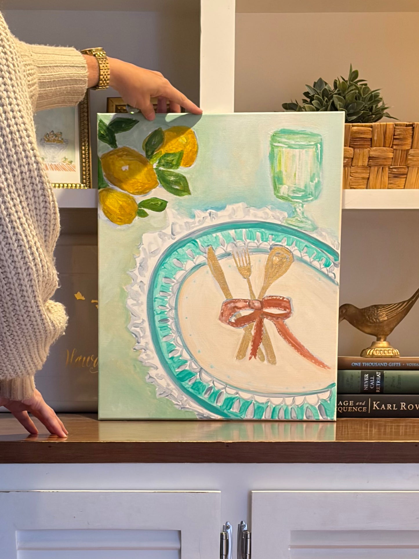 Original still life painting by Breanna Megan Studio shown at hand to illustrate the artwork's scale
