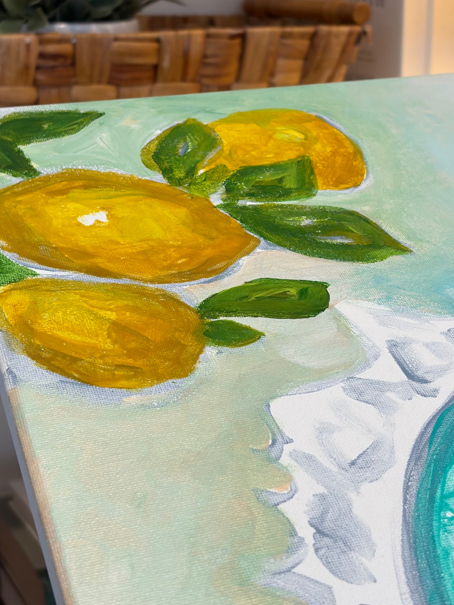 Detail of an original still life painting showing lemons, blue green background on canvas