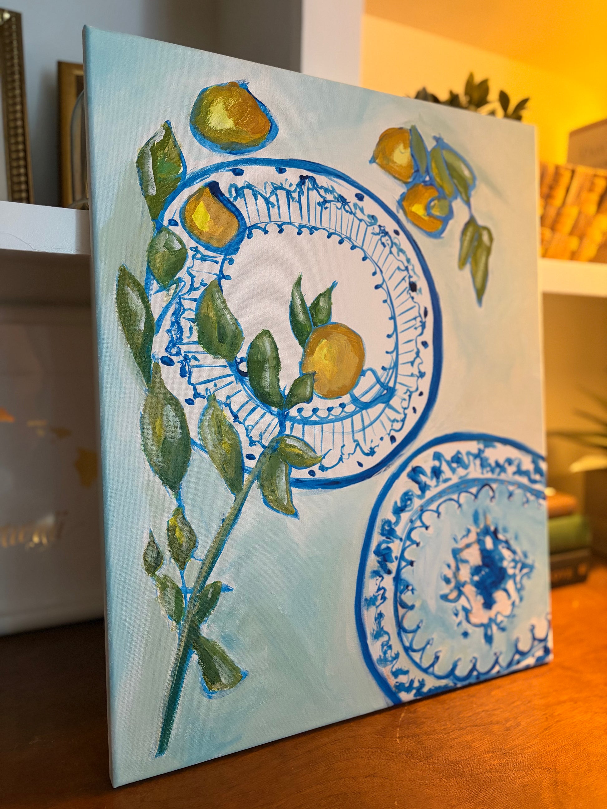Original lemon and blue porcelain painting displayed in an interior by Breanna Megan Studio