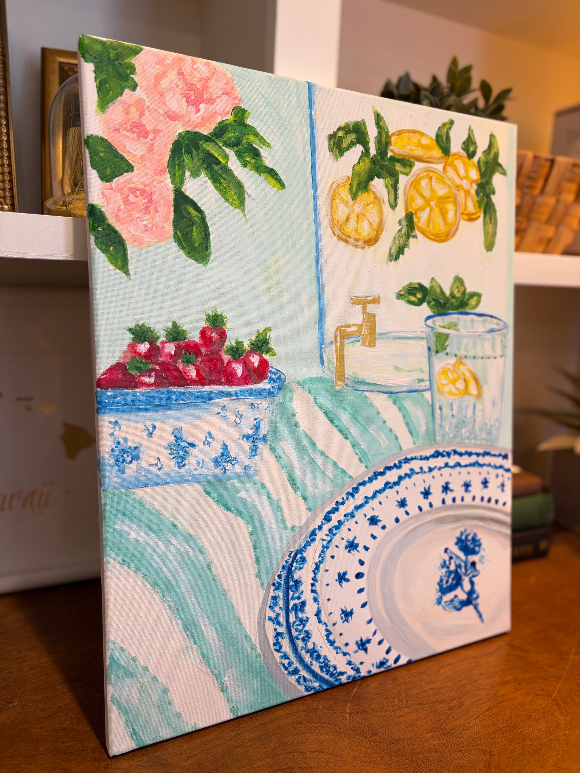 Original still life painting of lemons and blue porcelain displayed in a styled home interior