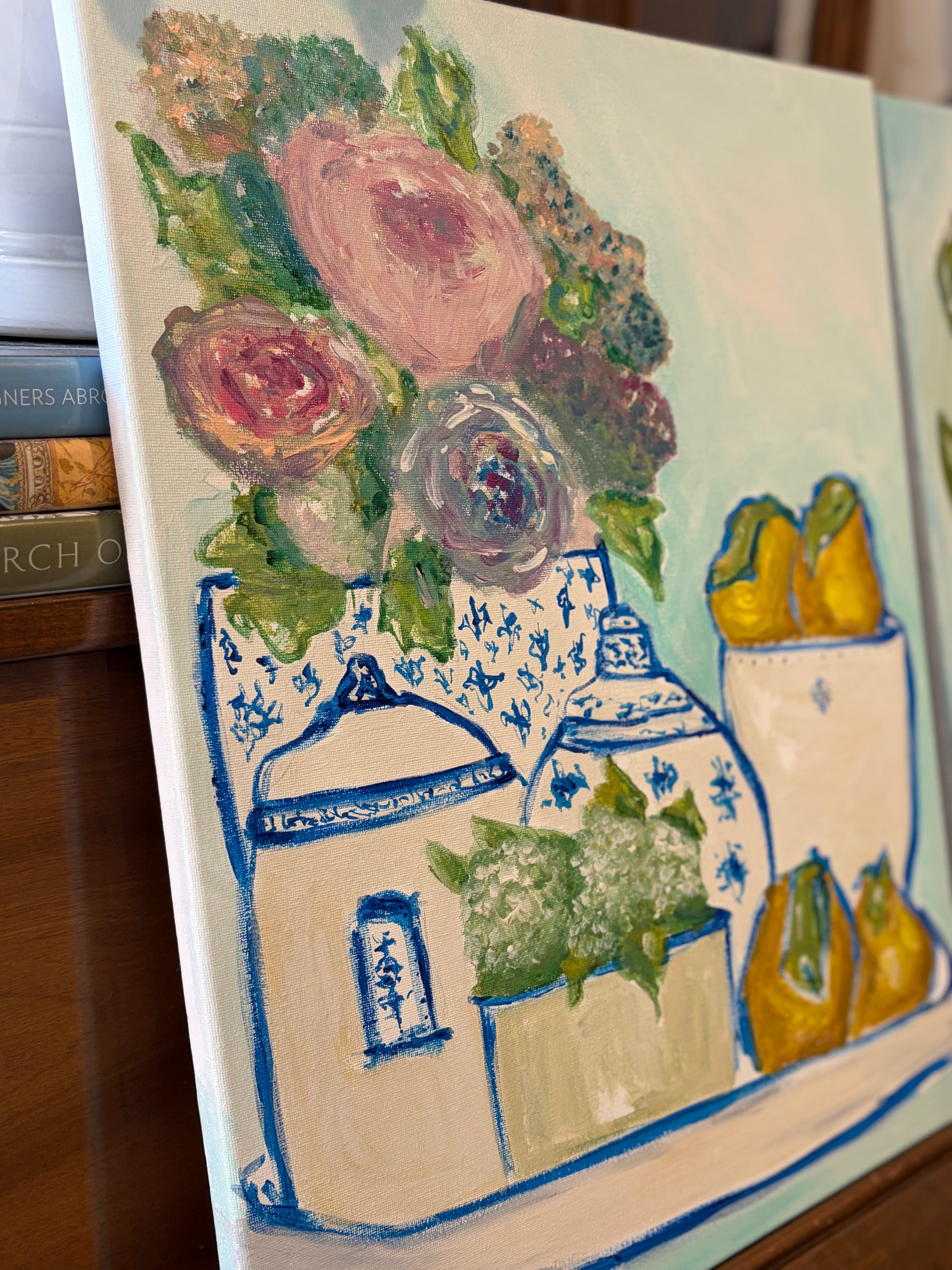 Close-up detail of painted porcelain, flowers, and lemons showing the brushwork and canvas texture